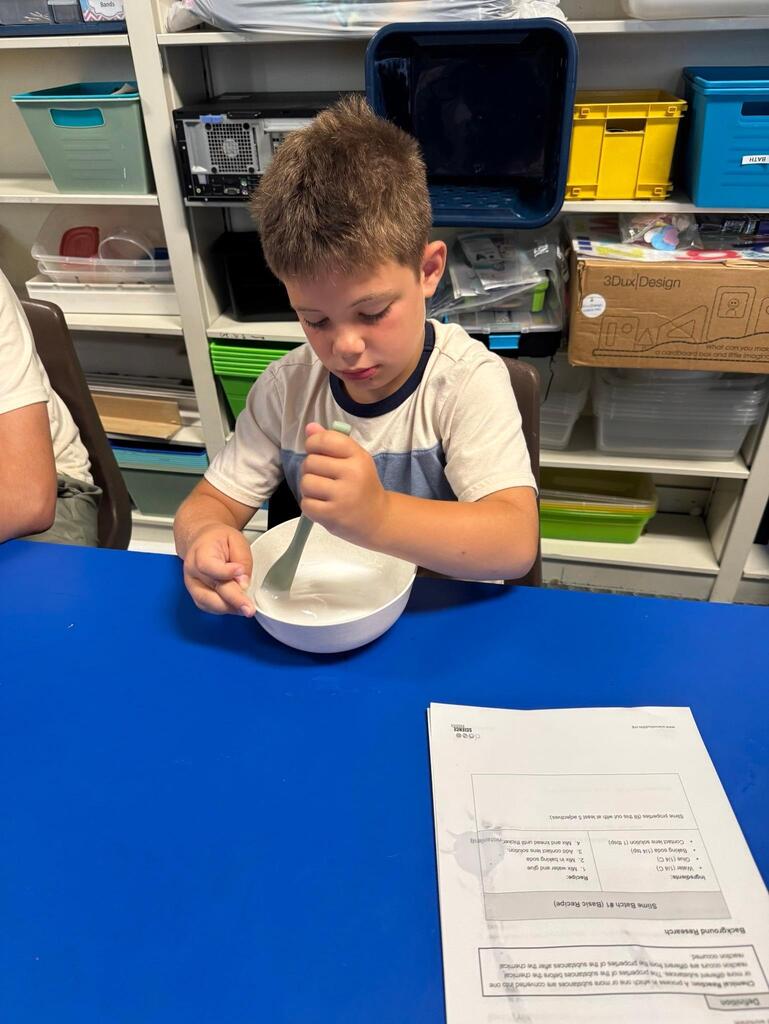 students make slime at chemistry themed summer day camp