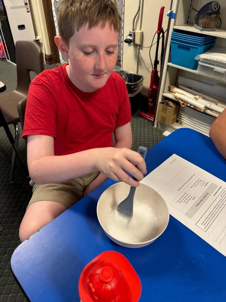 students make slime at chemistry themed summer day camp