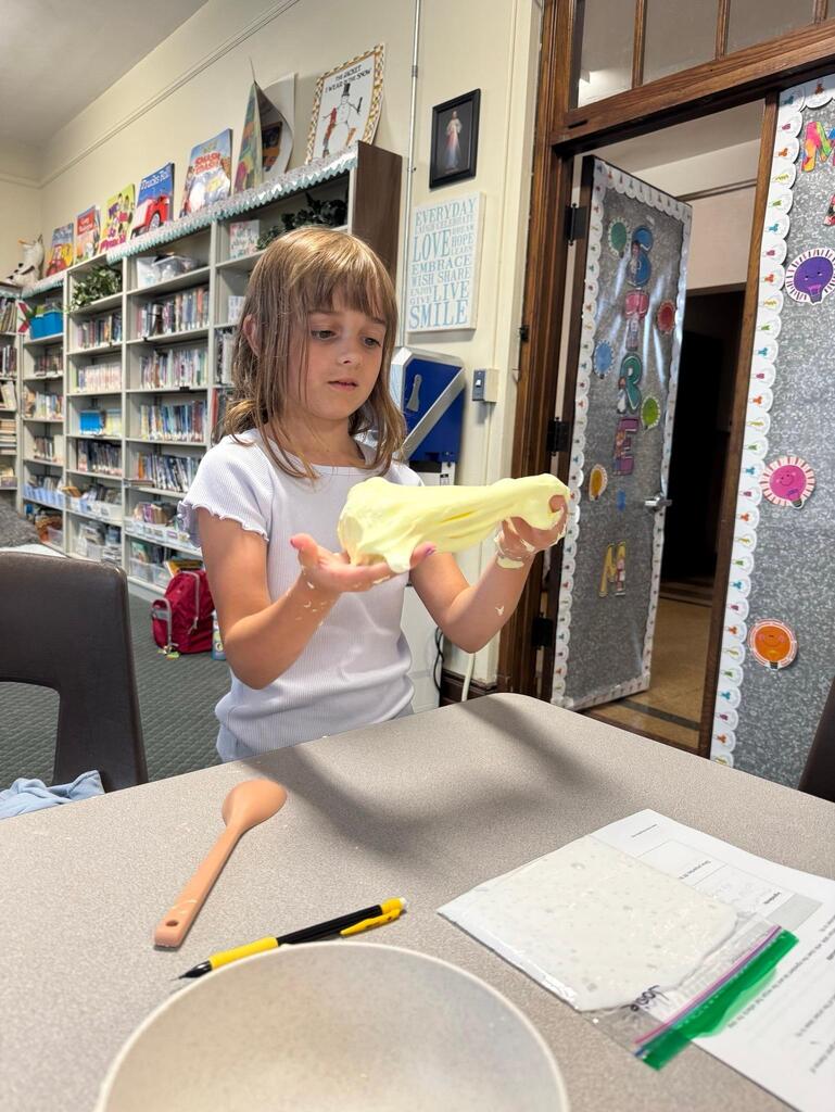 students make slime at chemistry themed summer day camp