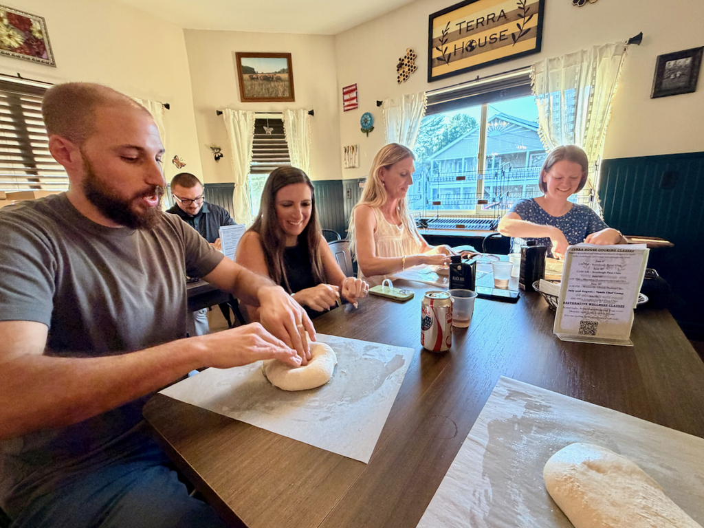 teachers make pizza at Terra House