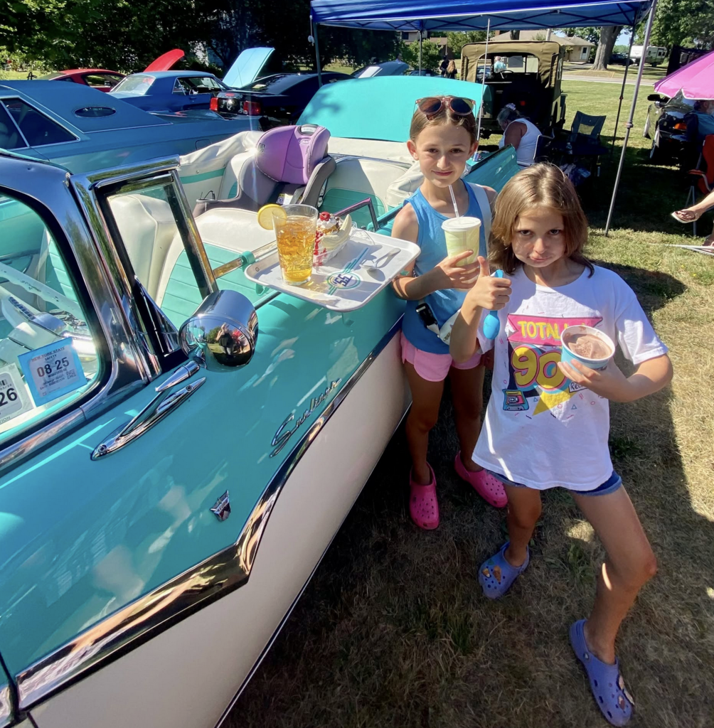 children enjoying car show