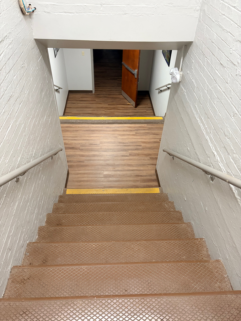 New lower level flooring in school with an updated, wood look