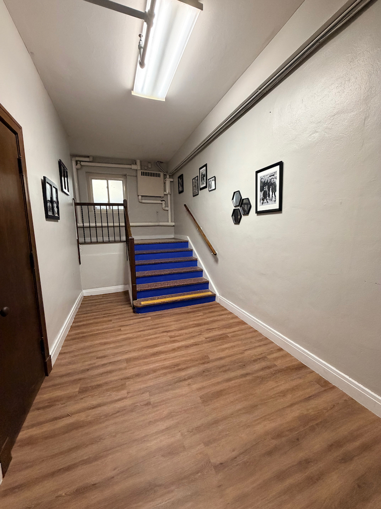 New lower level flooring in school with an updated, wood look