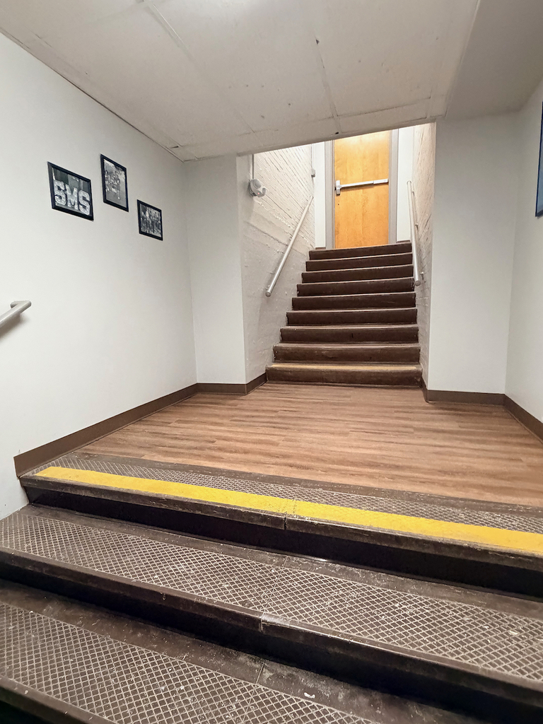 New lower level flooring in school with an updated, wood look