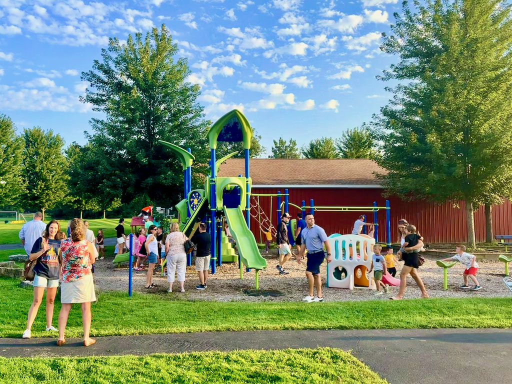 Families mill around school playground