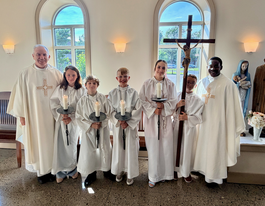 altar servers with priests before Mass
