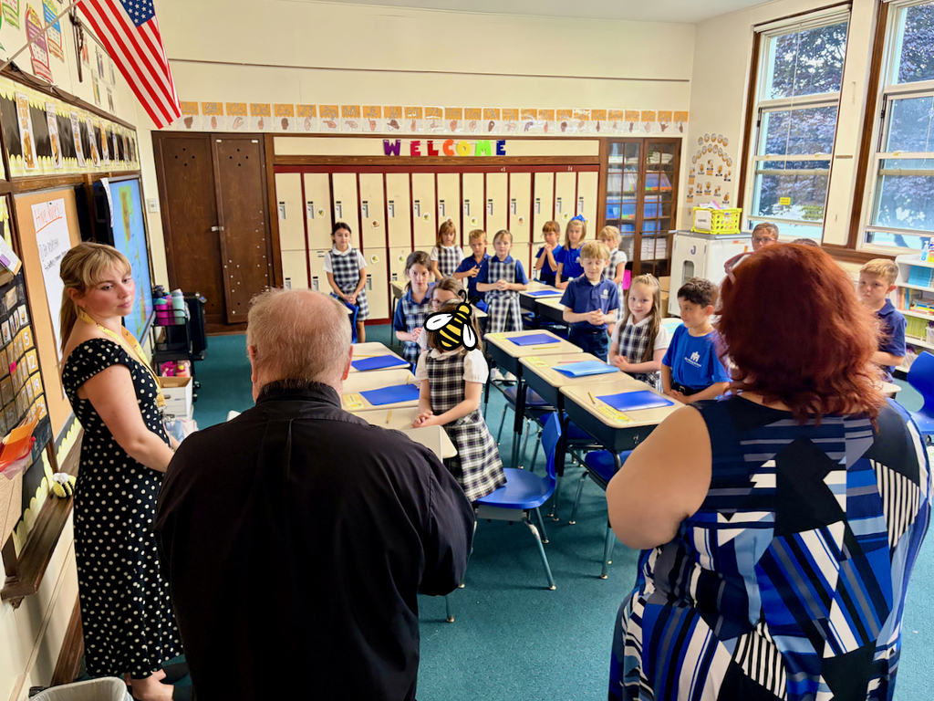 Father Tom & principal visit classrooms for back to school blessing