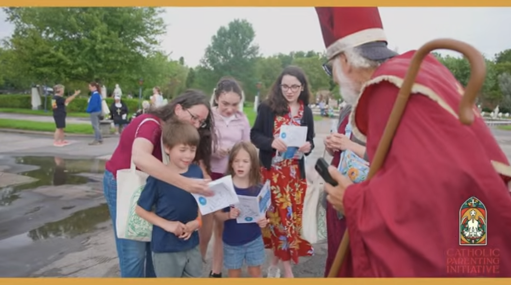 Family learning from a performer dressed up as St. Nicholas