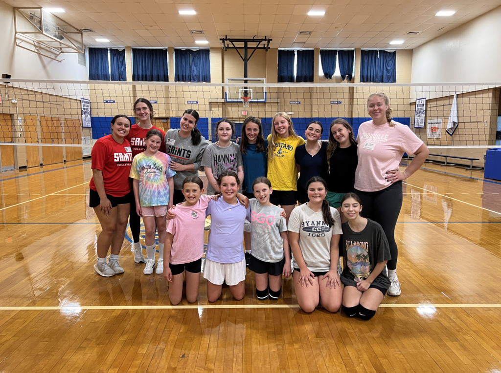 Girls volleyball team posing for photo