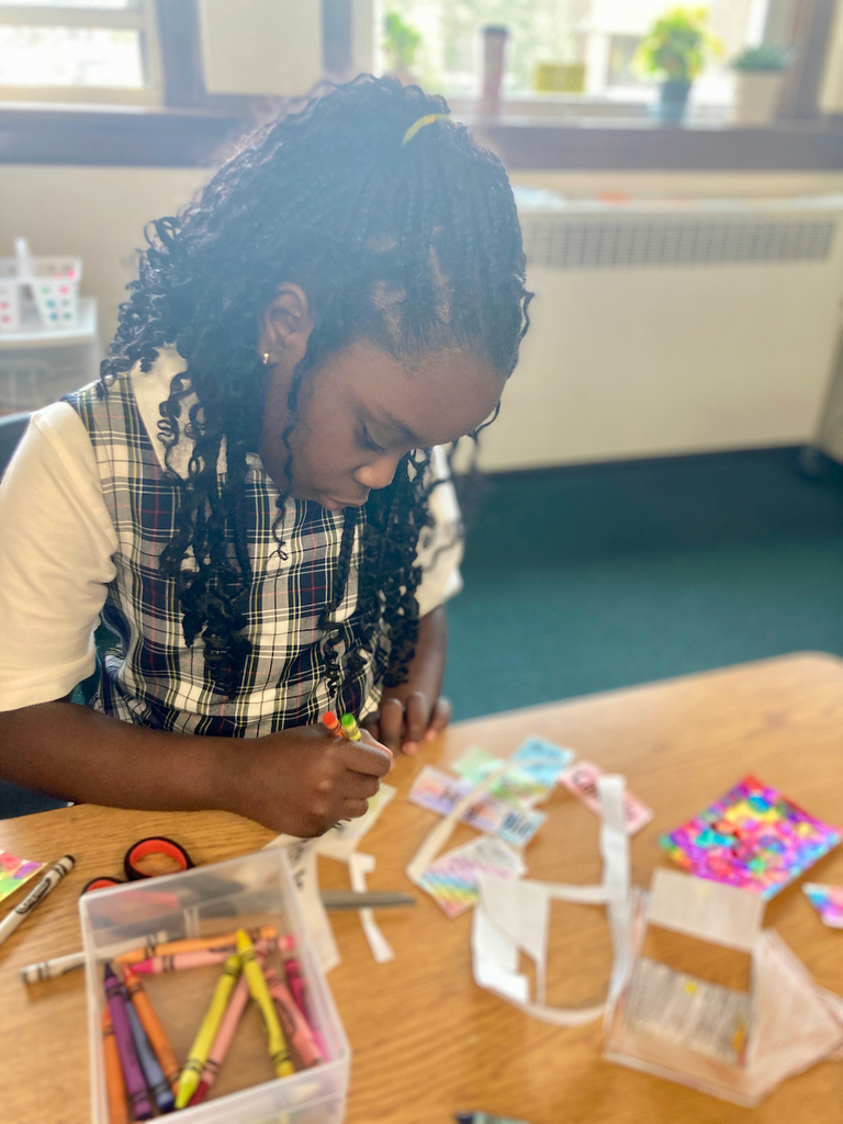 student coloring a project