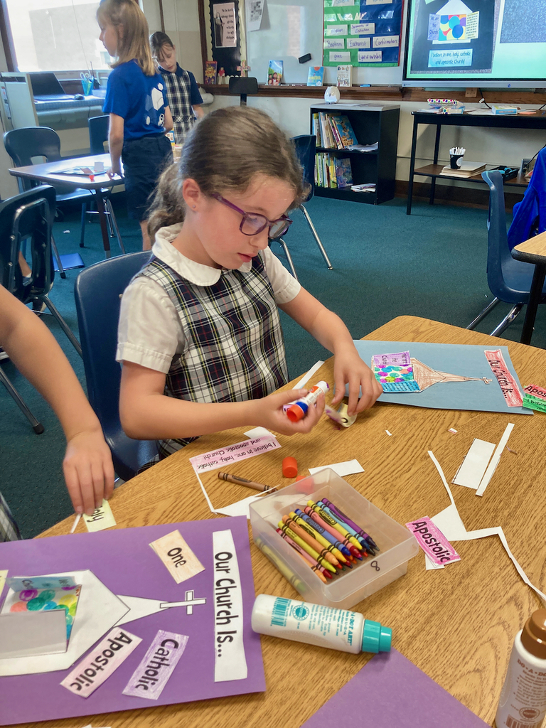 Student using a glue stick