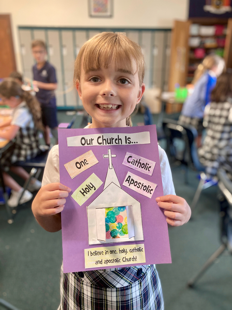 student showing off their work