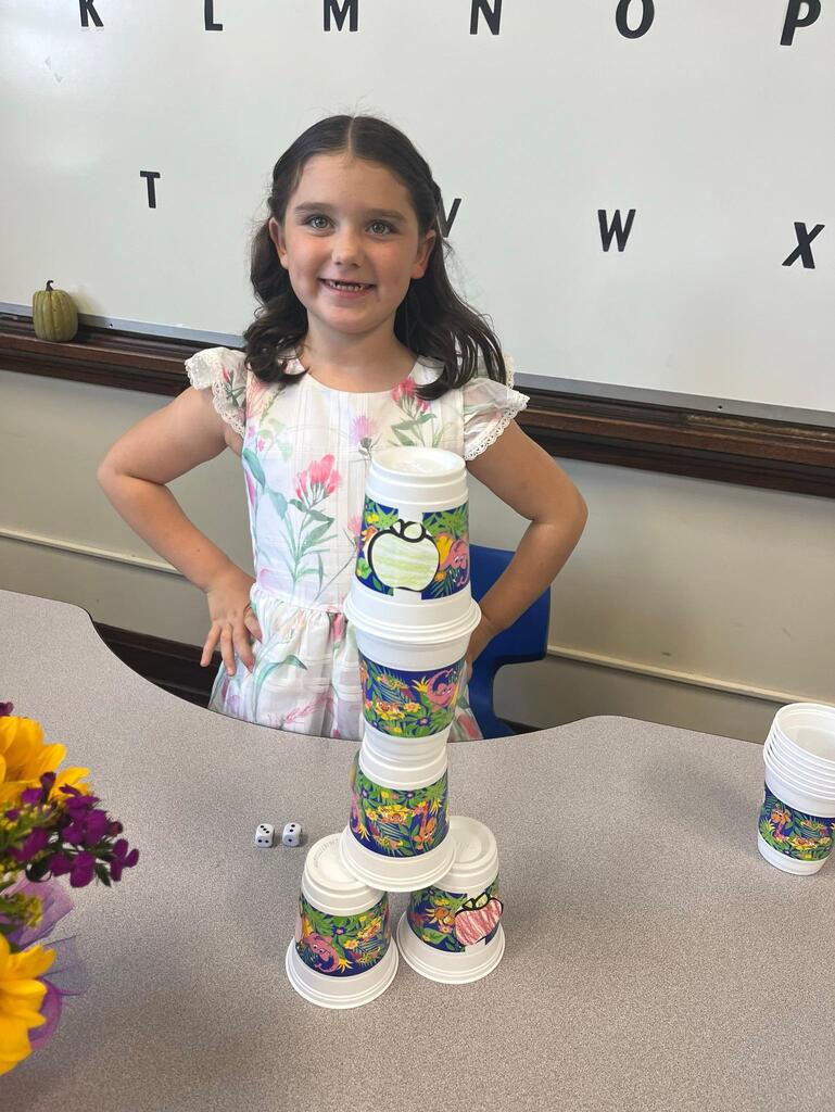 girl with cup stacking game