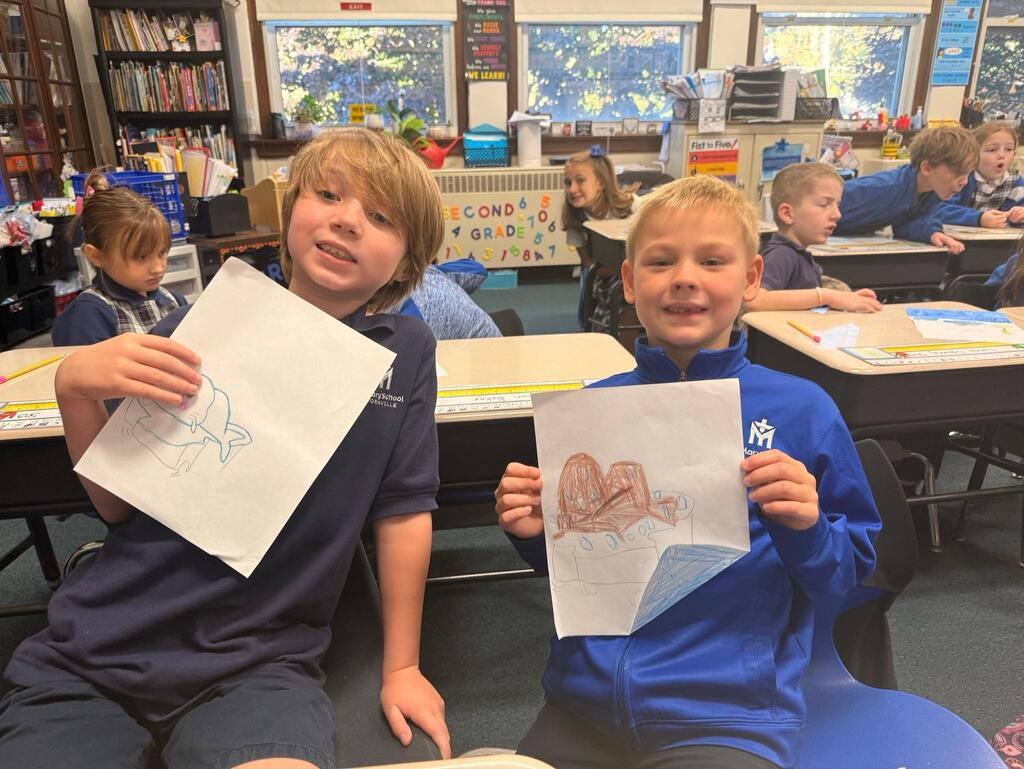 students with drawings of seals