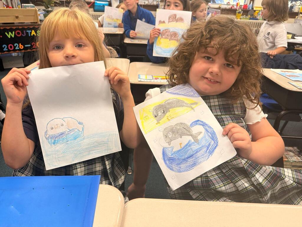 students with drawings of seals