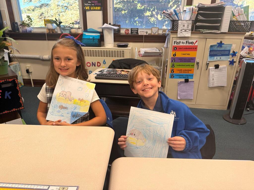 students with drawings of seals