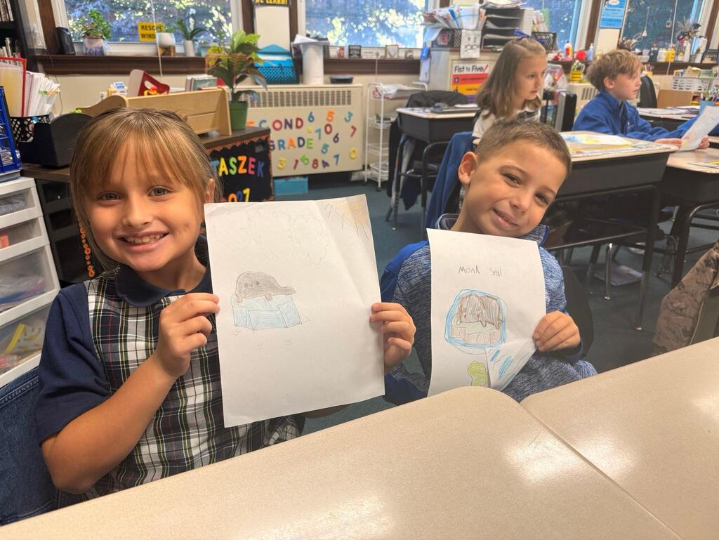 students with drawings of seals