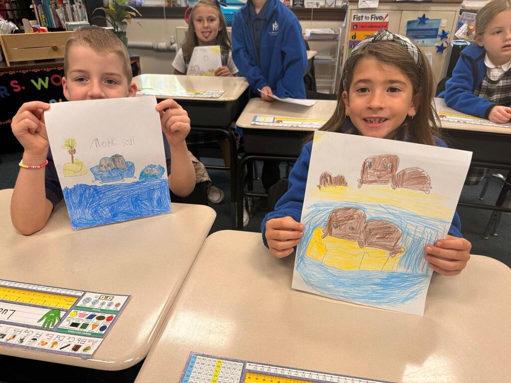 students with drawings of seals