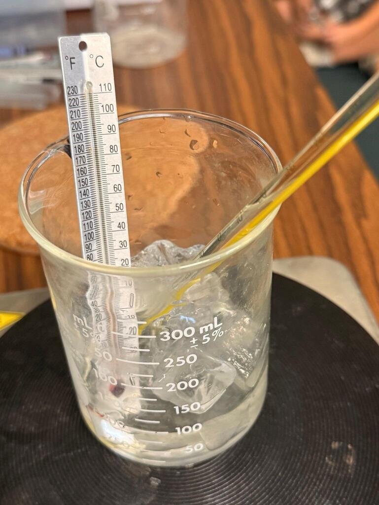 ice water in beaker with thermometer