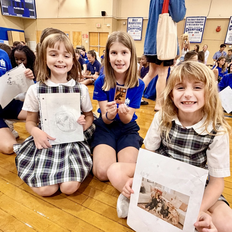 Father Peter blesses students with holy water