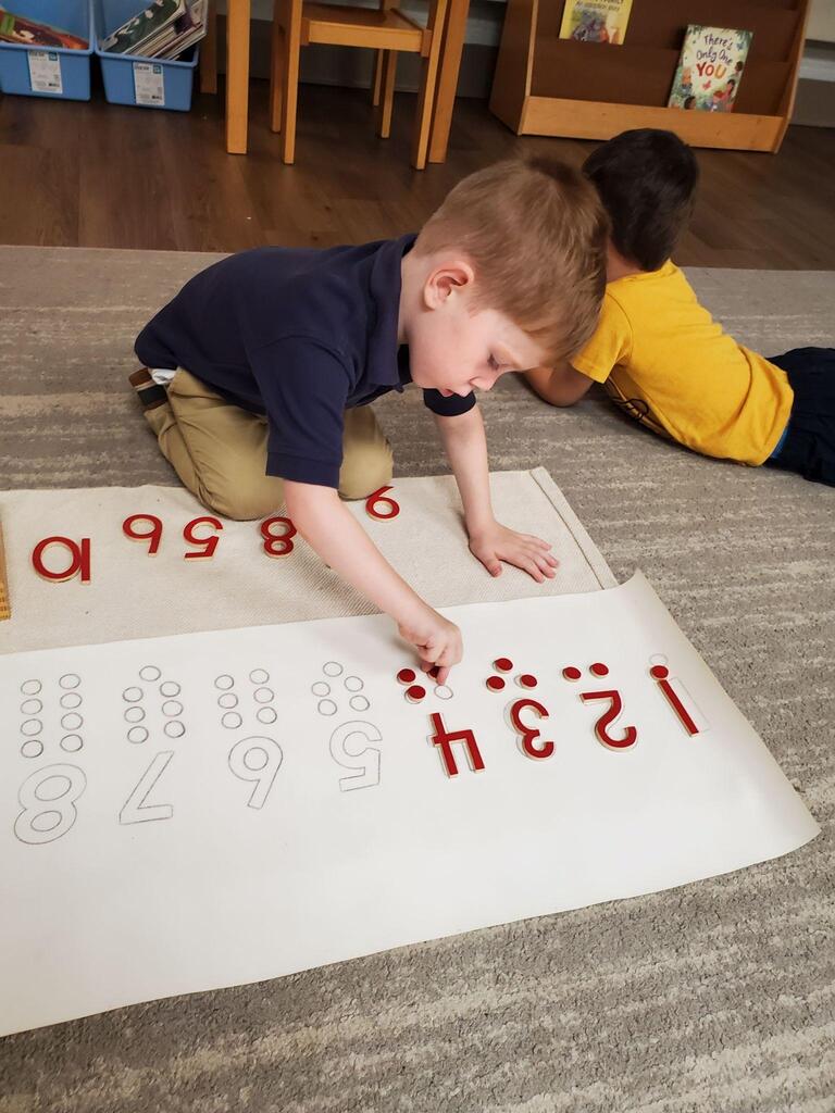 Montessori students at work in their classroom