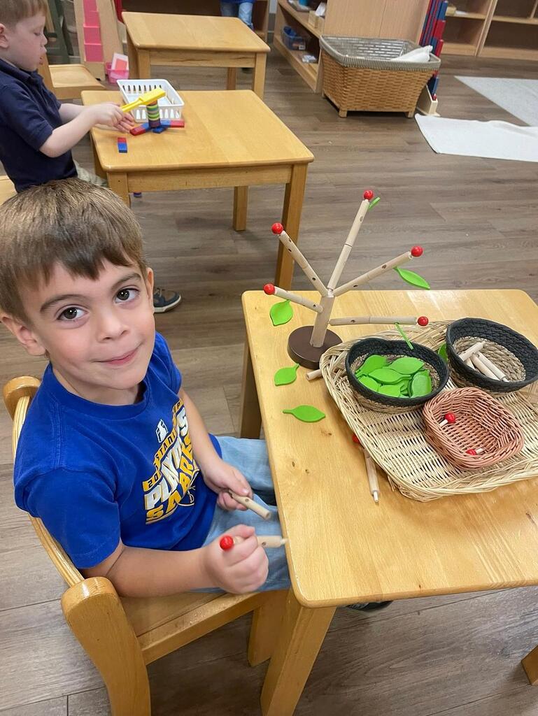 Montessori students at work in their classroom