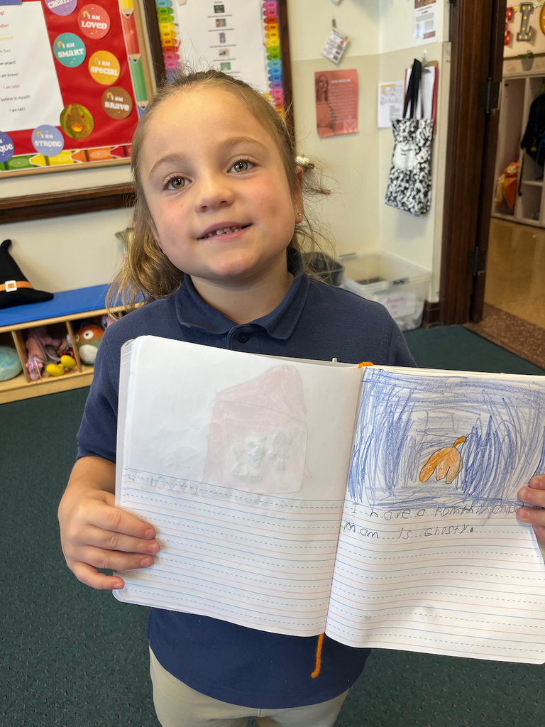 student posing with journal