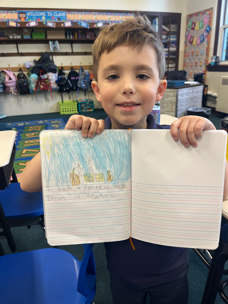 student posing with journal
