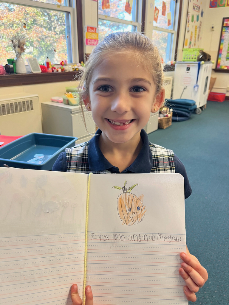 student posing with journal