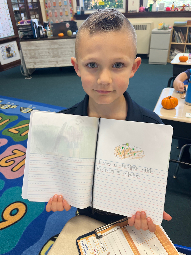 student posing with journal