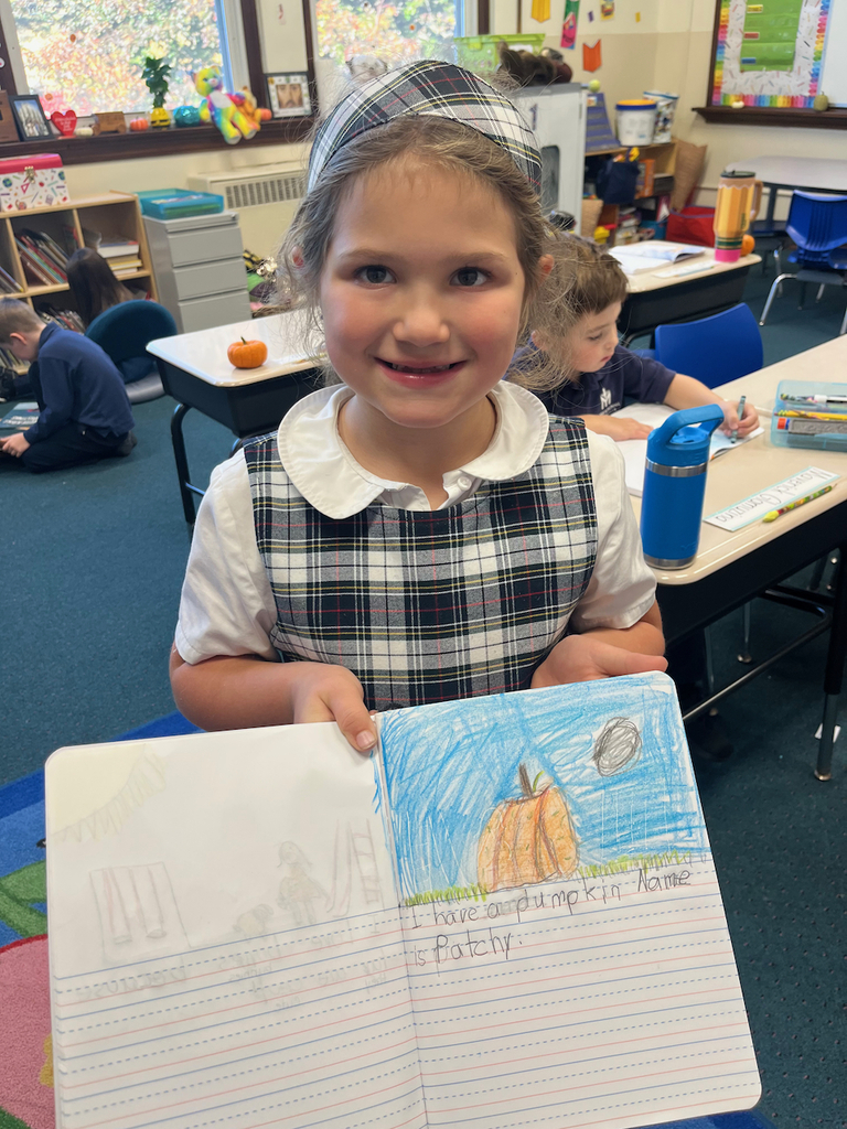 student posing with journal