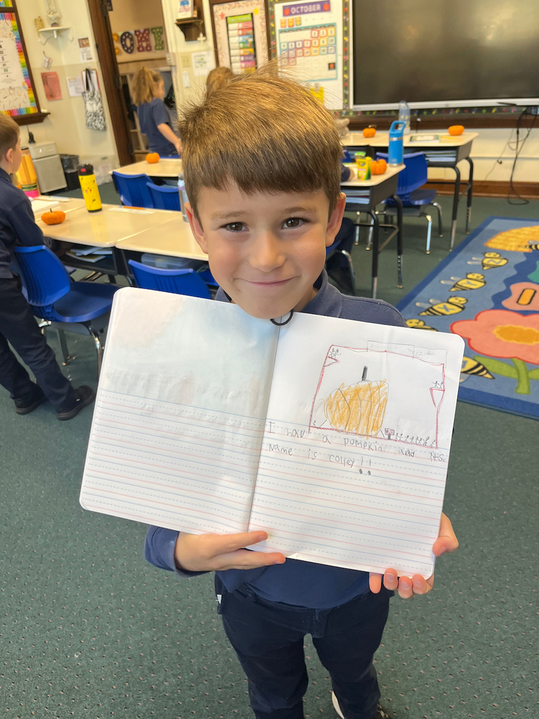 student posing with journal