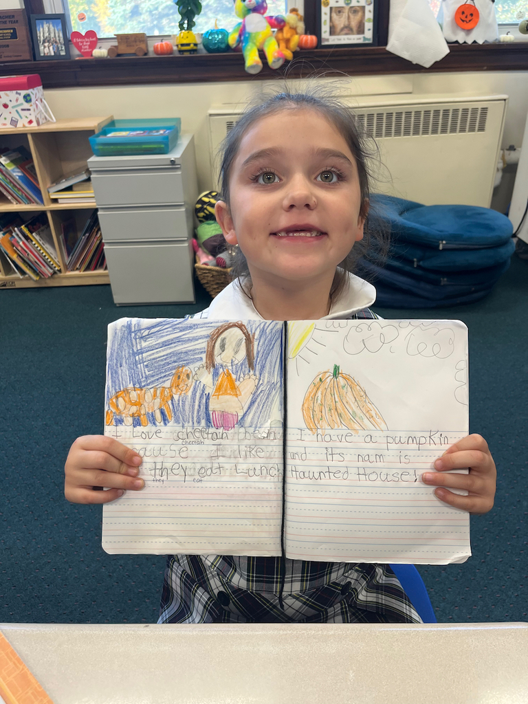 student posing with journal