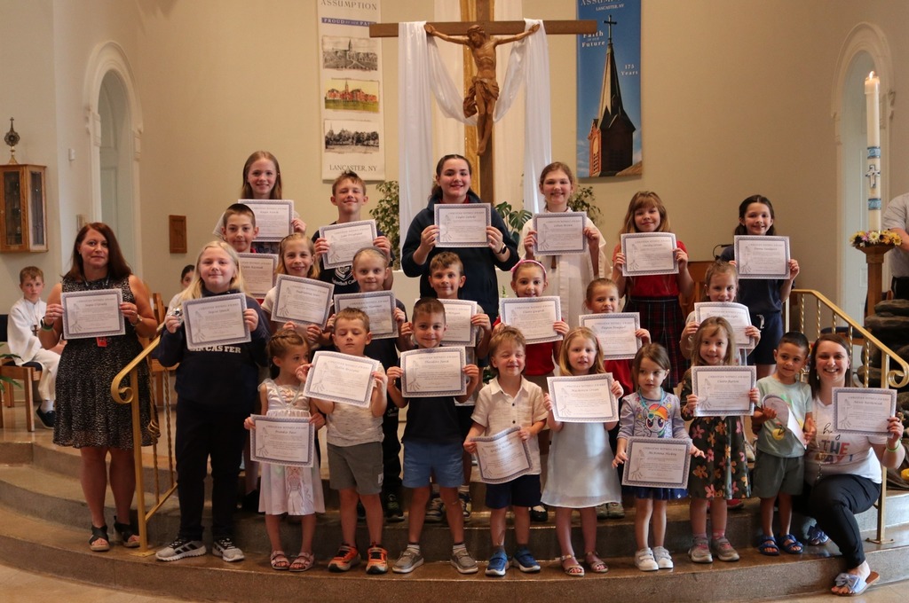 A group of kids holding certificates