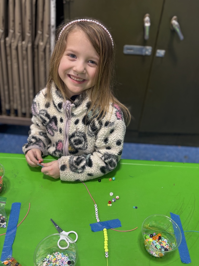 Our students are busy crafting their lucky charm bracelets with lots of focus ... and even bigger smiles!