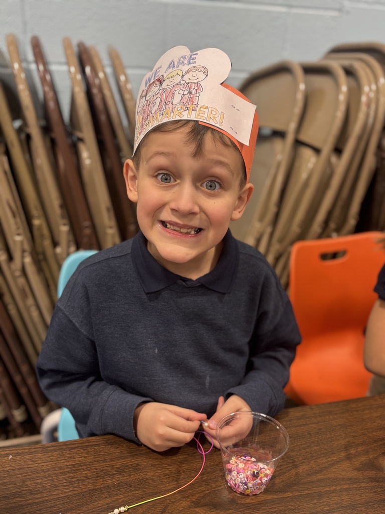 Our students are busy crafting their lucky charm bracelets with lots of focus ... and even bigger smiles!