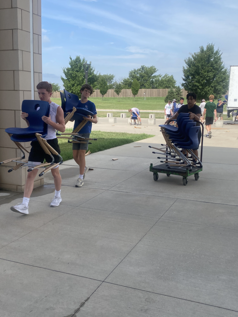 Team unloading chairs