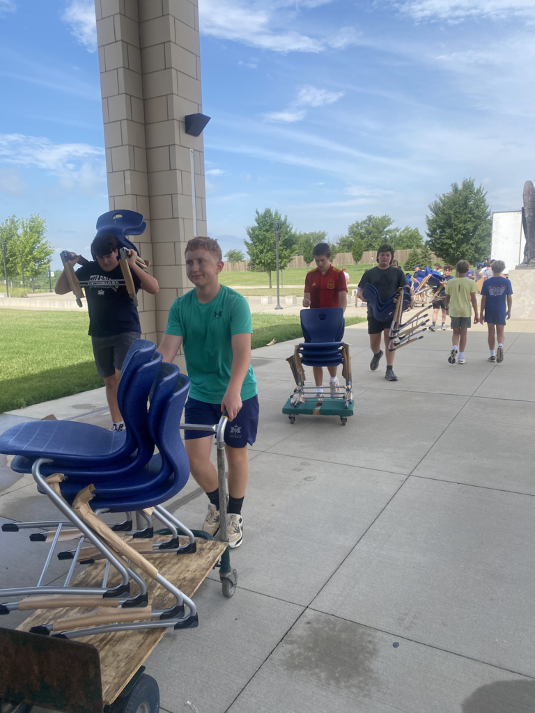 Team unloading chairs