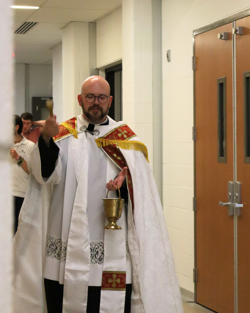 Fr. Osborn blesses the school.