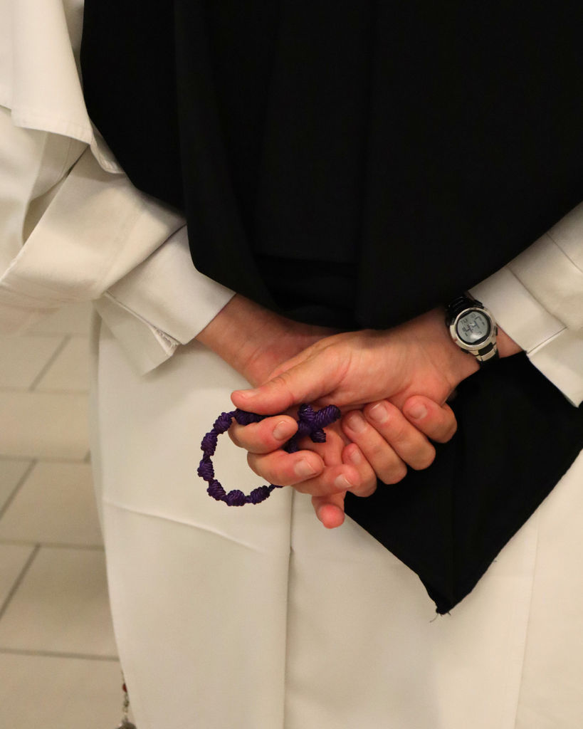 Sister prays the rosary.