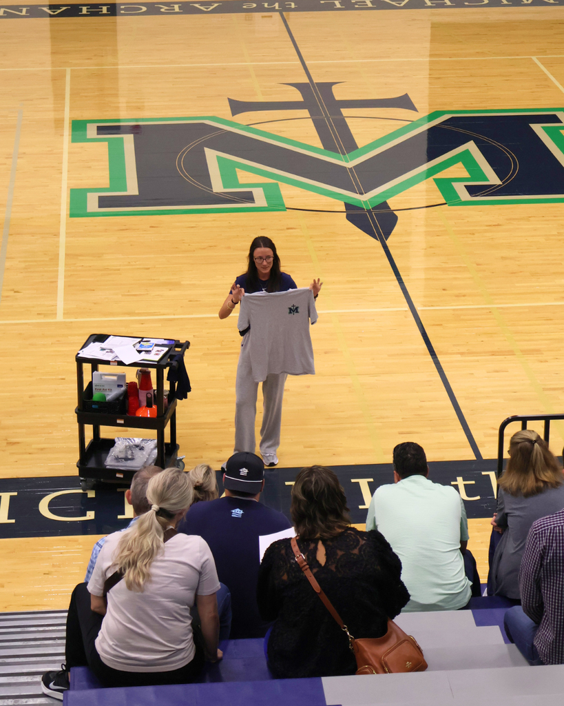 Coach Boessen presents to parents.