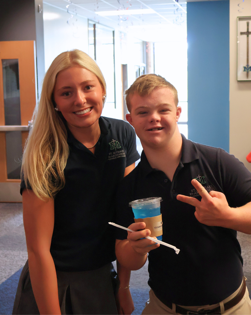 Chanley and Brooks pose with a drink.