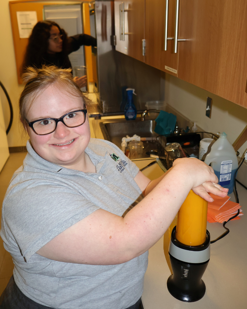 Tori makes a smoothie.