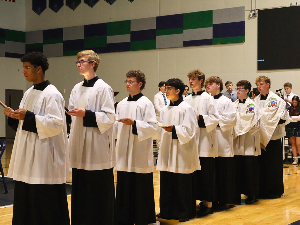 Altar servers receive communion.