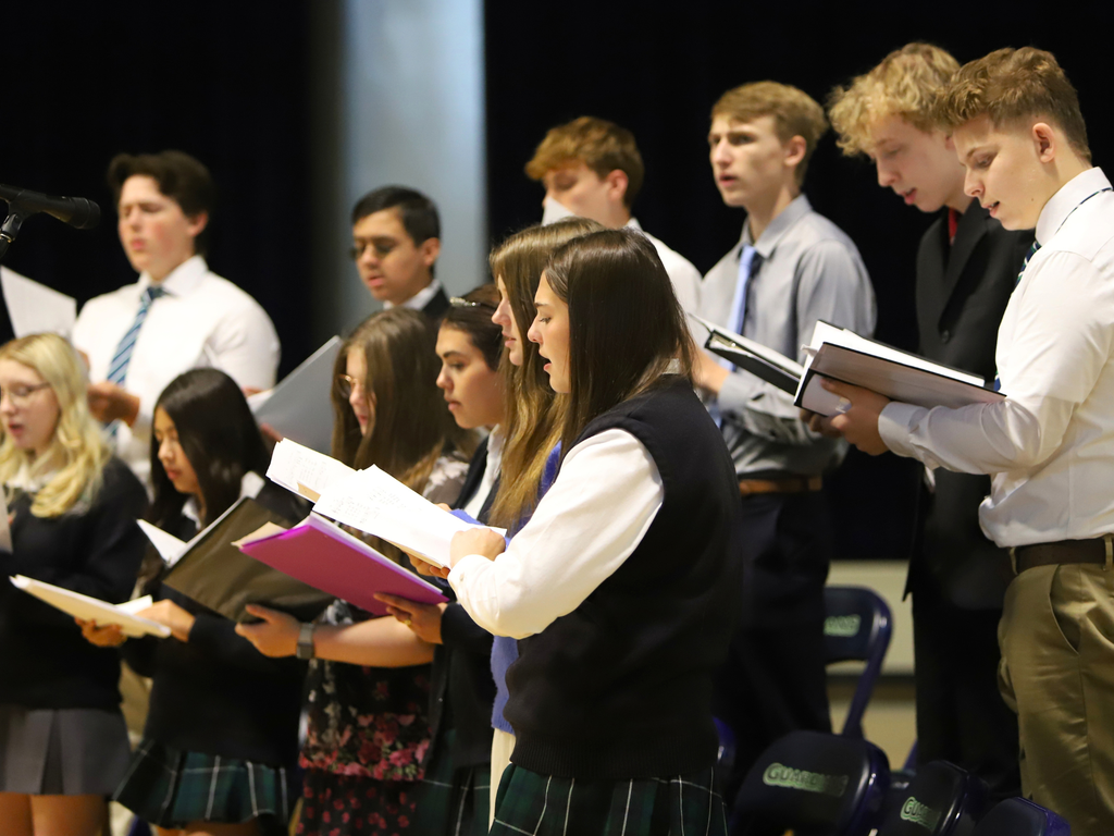Choir students sing at Mass.
