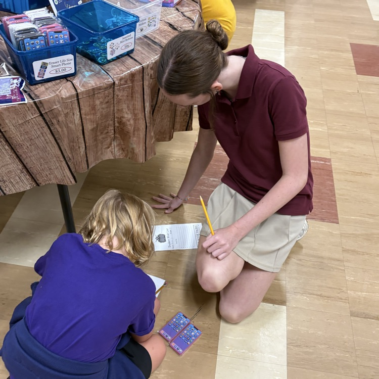 Eighth Grade helping their First Grade Chapel Buddies
