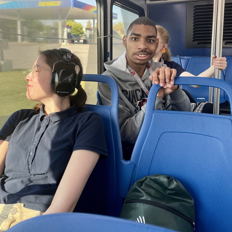 students sitting on the bus