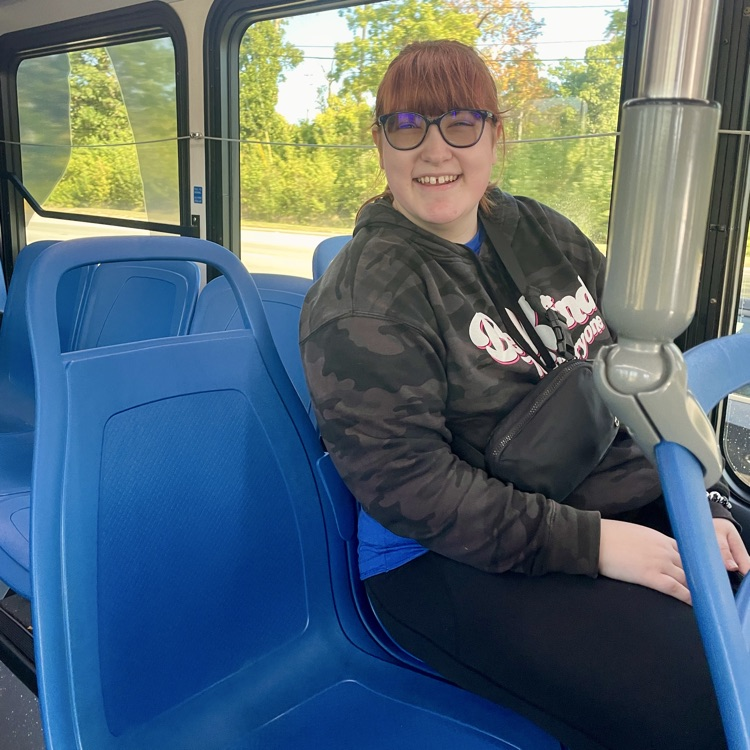 student sitting on the metro