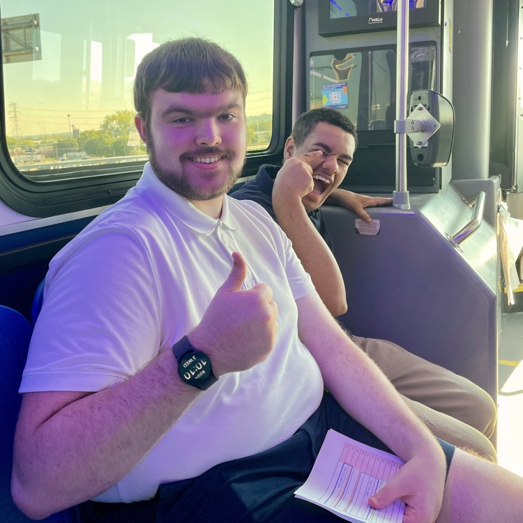 students sitting on the metro bus