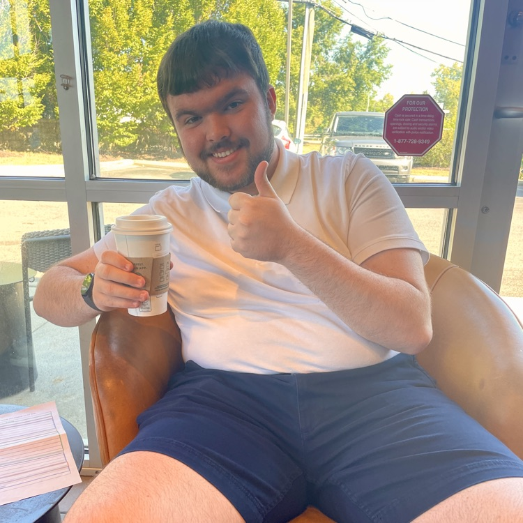 Student enjoying his hot chocolate 